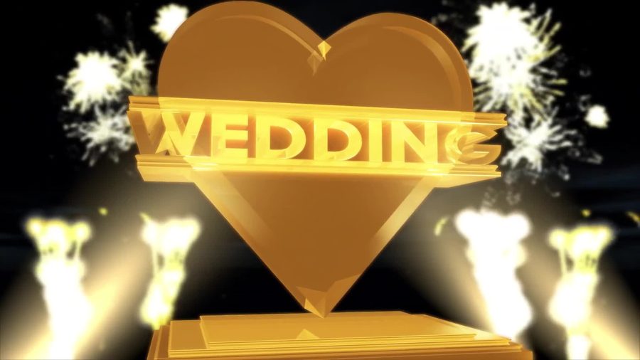 黒背景に光の粒が舞う中金色の立体的なWEDDINGの文字とハートのロゴが浮かび上がる映画の予告編風の演出のオープニングシーン